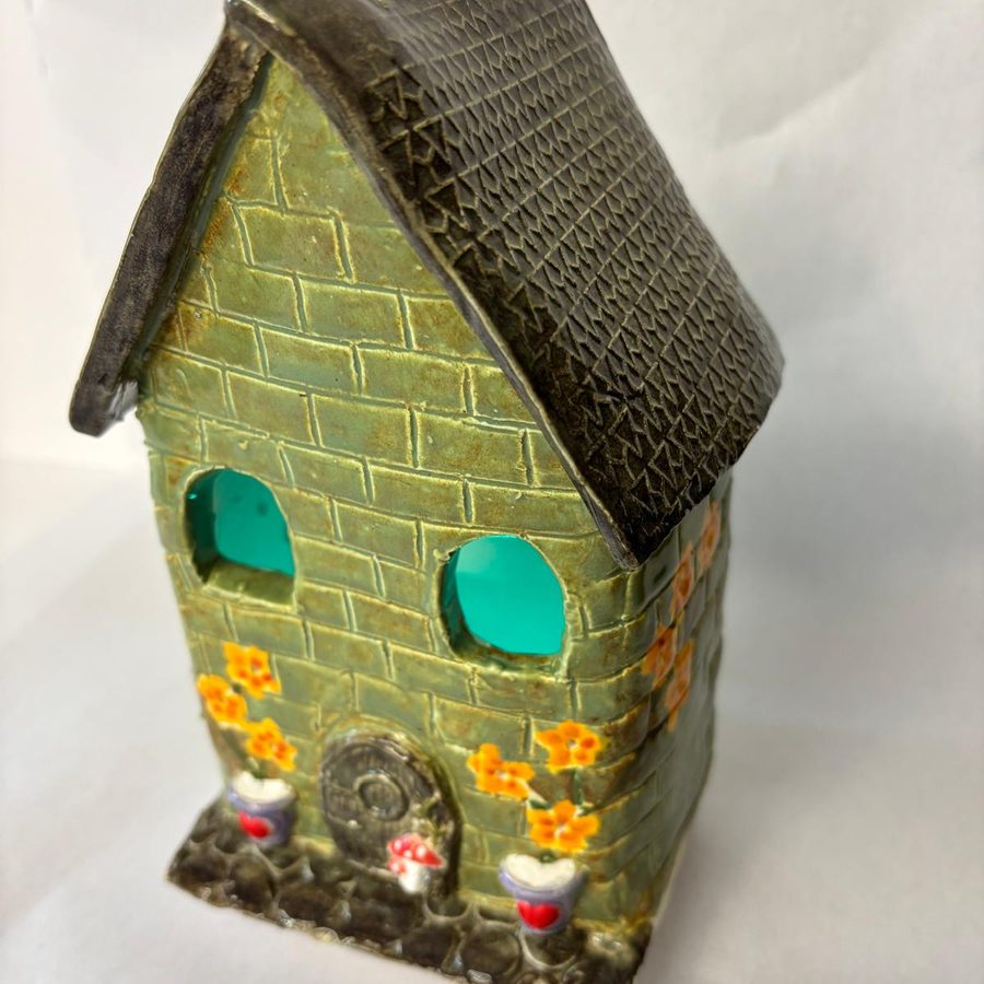 A finished clay house with a tiled roof