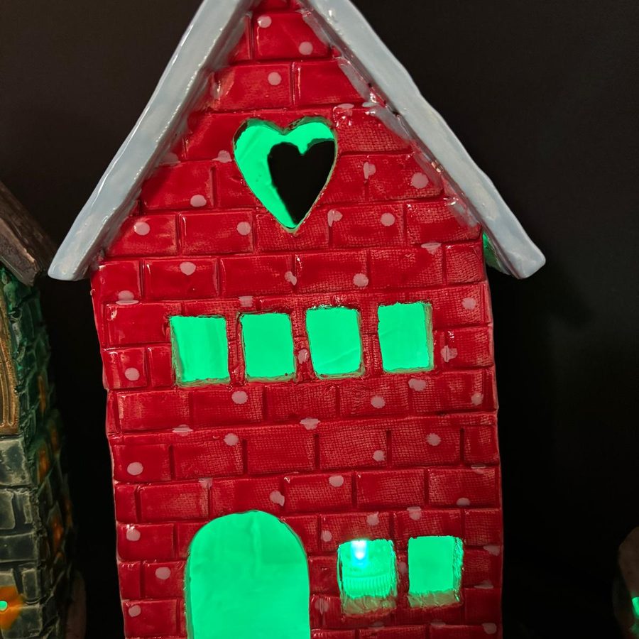 A clay house lit up in the dark